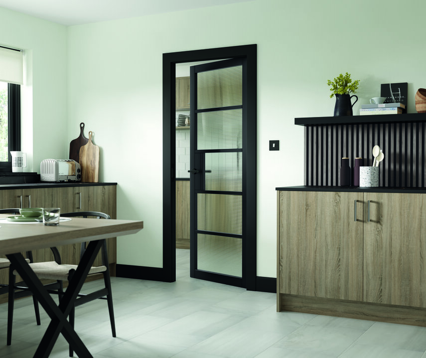 Urban style black glazed internal door with contemporary reeded / fluted glasss